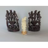 Pair of far eastern carved character groups of three dancers flanked by coiled snakes and a