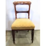 A set of four Victorian mahogany dining chairs, with shaped bar splats, over upholstered seats and