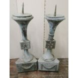 A pair of copper (verdigris finish) pricket candlesticks, raised on triangular bases, 85cm tall