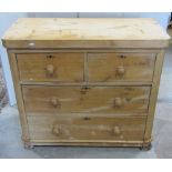 A Victorian stripped pine bedroom chest of two short over two long drawers, flanked by rounded