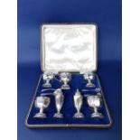 Good quality cased seven piece silver cruet comprising four salts, a lidded mustard and two peppers,