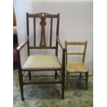 A 19th century child's chair partially in elm, an oak elbow chair with carved and pierced splat