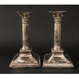 Good pair of early George III silver corinthian column candlesticks, with good open work acanthus