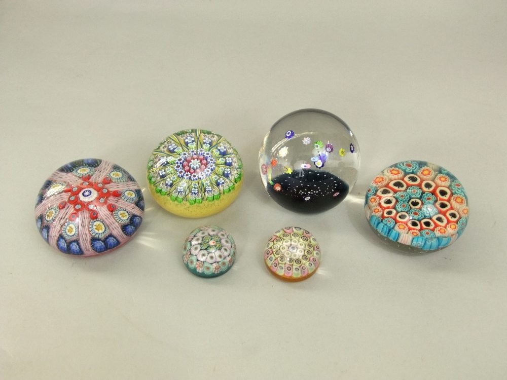 A collection of six Millefiori glass paperweights with various cane work decoration (6)