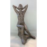 Cold cast resin sculpture of a seated nude female, 48 cm high