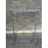 A contemporary floor standing light steel framed hall stand/clothes rail with decorative pierced