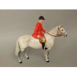 A Beswick figure of a huntsman on a dappled grey horse number 1501