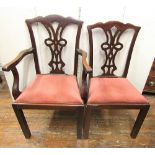 A set of eight (6+2) Georgian style mahogany dining chairs with ribboned tracery splats, drop in