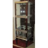 An Edwardian free-standing shop display cabinet of square cut form, enclosed by a single door,