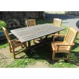 A Swan Hattersley weathered teak garden table, the rectangular slatted top raised on square cut