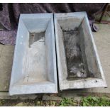 A pair of galvanised shallow troughs of rectangular and tapered form, 108 cm long x 50 cm wide x