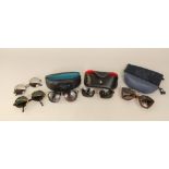 4 pairs of designer sunglasses including glasses marked Ray Ban,Giorgio Armani, Ted Baker (with