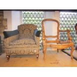 A pair of Victorian nursing or low drawing room chairs with upholstered seats and button backs