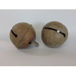Two large Crotal bells, 11cm diameter, marked 24 and monogrammed EW probably Edne Witts