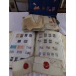 A small suitcase containing a quantity of unsorted loose stamps, documents and postal history,