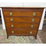 A small Georgian mahogany chest of four long graduated drawers together with a brush slide, shaped