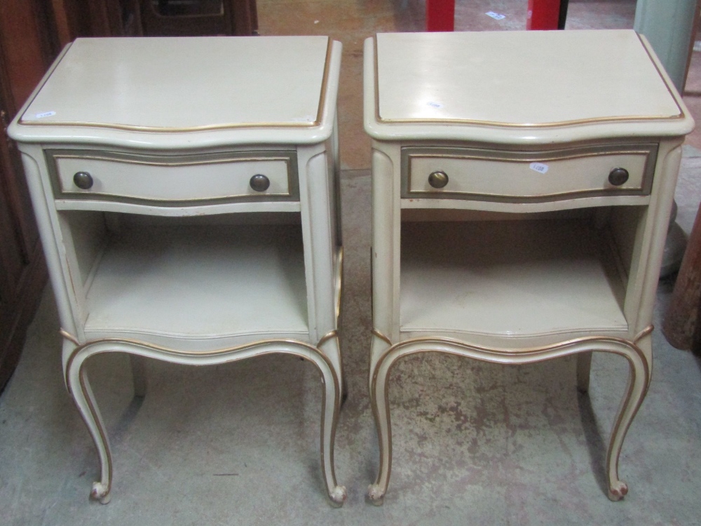 A pair of reproduction light green painted bedside lamp tables, the serpentine front fitted with a