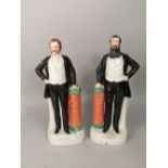 A pair of 19th century Staffordshire figures of Moody and Sankey, both with moulded titles to front,