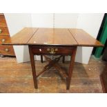 A Georgian mahogany drop leaf tea table with single frieze drawer raised on square chamfered