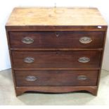 A small 19th century mahogany caddy top bedroom chest of three long graduated drawers with shaped