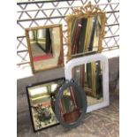 Five small decorative wall mirrors of varying design, two with later painted frames