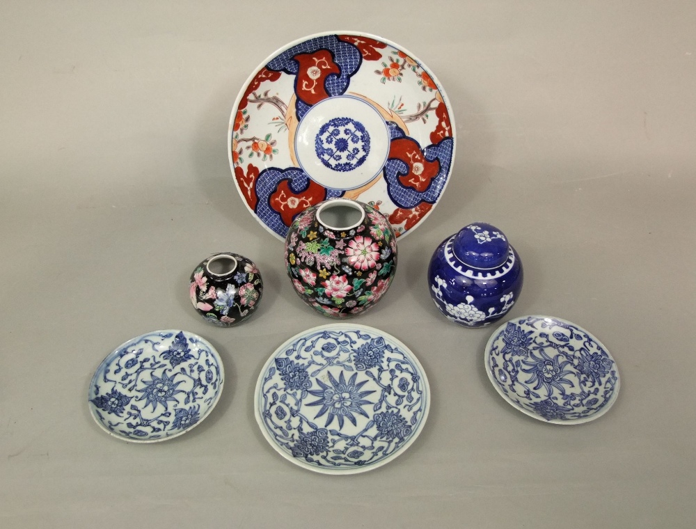 A collection of oriental ceramics including an Imari dish, 28cm diameter, a pair of dishes with blue