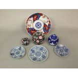 A collection of oriental ceramics including an Imari dish, 28cm diameter, a pair of dishes with blue