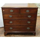 A Georgian mahogany and pine sided chest of three long and two short drawers, with embossed brass