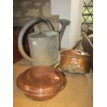 A galvanised watering can of oval form complete with rose, together with a 19th century copper bed