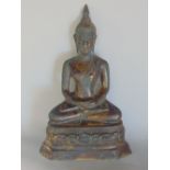 Filled bronze/brass Buddha vista in seated position, 18cm high