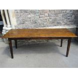A 19th century French provincial farmhouse kitchen table, the rectangular tongue and groove