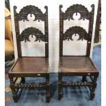 A pair of Yorkshire ladderback jointed back stools with geometric carved detail, solid seats