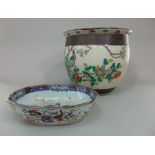 An oriental fish bowl with polychrome painted bird and floral decoration, crackle glazed finish,