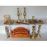 A collection of good metal wares to include various candlesticks, a pierced brass ink standish, an