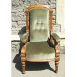 A substantial Victorian oak library or drawing room chair with Ionic capital supports, further