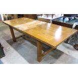 A good quality contemporary oak farmhouse kitchen table of rectangular form, the drawleaf top with