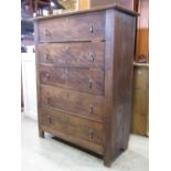 An antique oak bedroom chest of five long drawers with brass pear drop handles, 100cm wide