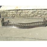 A 19th century polished steel serpentine fender with pierced geometric decoration, 140cm long x 31cm