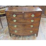 A Regency mahogany bow fronted chest of three long and two short graduated drawers, with embossed