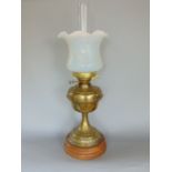 A late 19th century French brass oil lamp, with brass reservoir and tapered fluted column, upon a