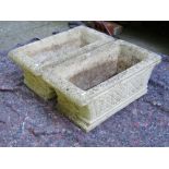 A pair of weathered contemporary cast composition stone flower troughs of rectangular form with