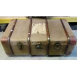 A vintage green canvas travelling trunk with timber lathes one other and a vintage wicker work