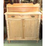 A Victorian stripped pine chiffonier, the shallow raised back with shaped outline supporting a shelf