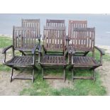 A set of six stained hardwood folding garden armchairs with slatted seats and backs