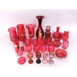 Quantity of cranberry glassware to include wine glasses, jugs, vases, etc (over 30)