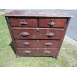 Victorian mahogany chest of drawers of three long and two short drawers with carved handles