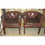 A pair of buttoned chocolate brown leather upholstered tub chairs with loose pad seats, square cut