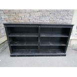 Aesthetic period open bookcase with ebonised finish with repeating geometric and floral detail