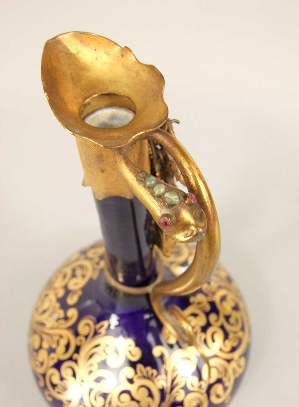 An unusual 19th century blue ground ewer with slender neck, gilded scrolling detail and ornate - Image 5 of 5