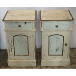 A pair of hardwood bedside cupboards, each enclosed by an arched panelled door beneath a frieze